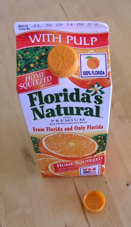 cartons of orange juice. of an orange juice carton.